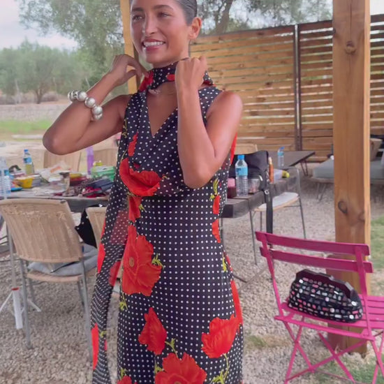 Try-on of the Black Poppy Sophie Dress showing the low V back, bias-cut drape and detachable scarf